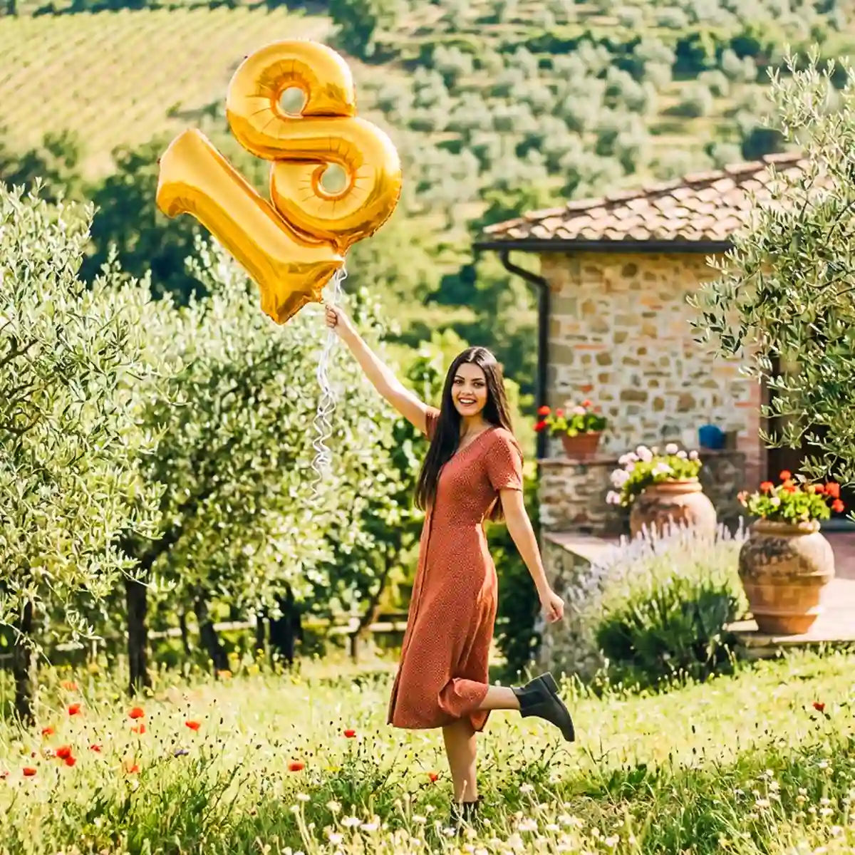 Fotografo per diciottesimi a Genova: ragazza festeggia con palloncini dorati a forma di 18 tra gli ulivi